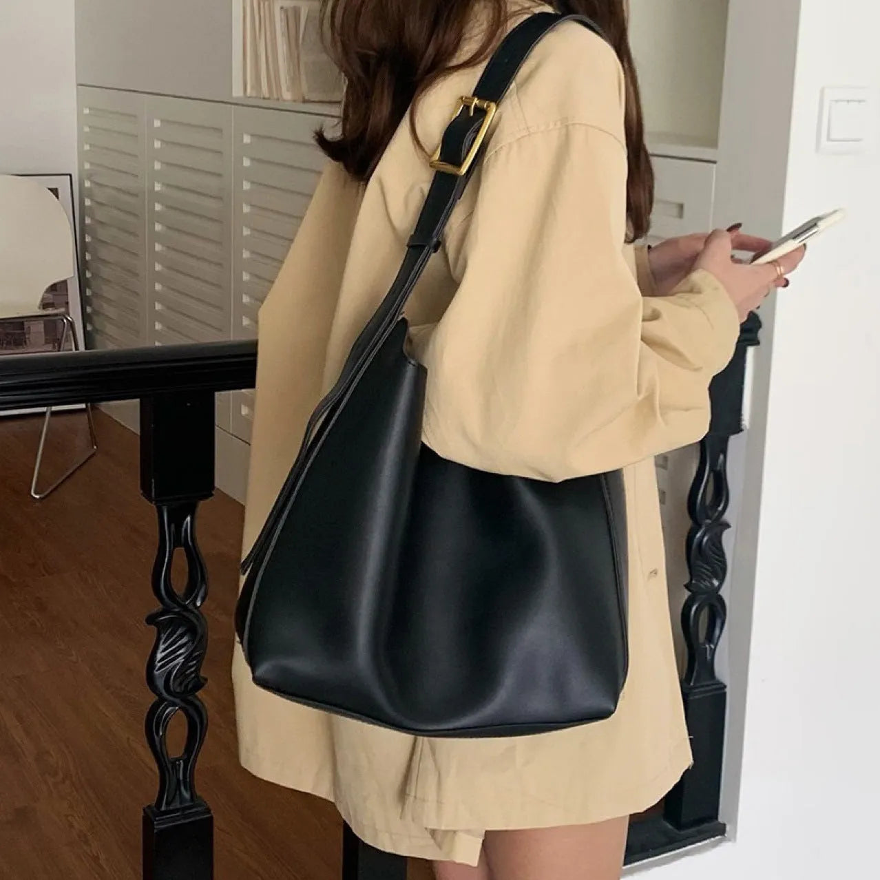 Women's soft PU shoulder bag with swing threads decoration in black or brown colour