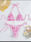 Women's floral print halter swimsuit bikini set in light blue on a mannequin