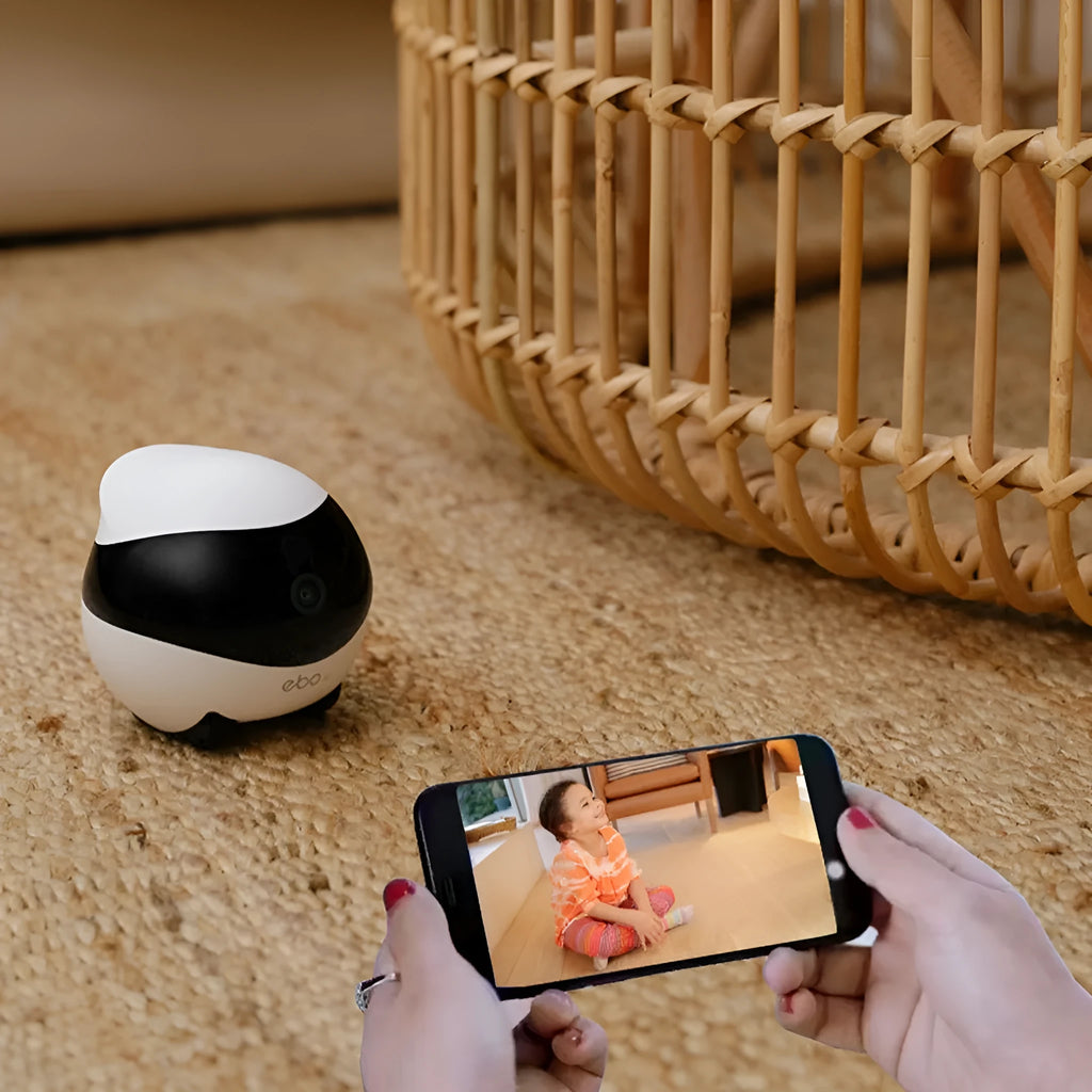 White smart home mobile surveillance robot camera with automatic charging dock