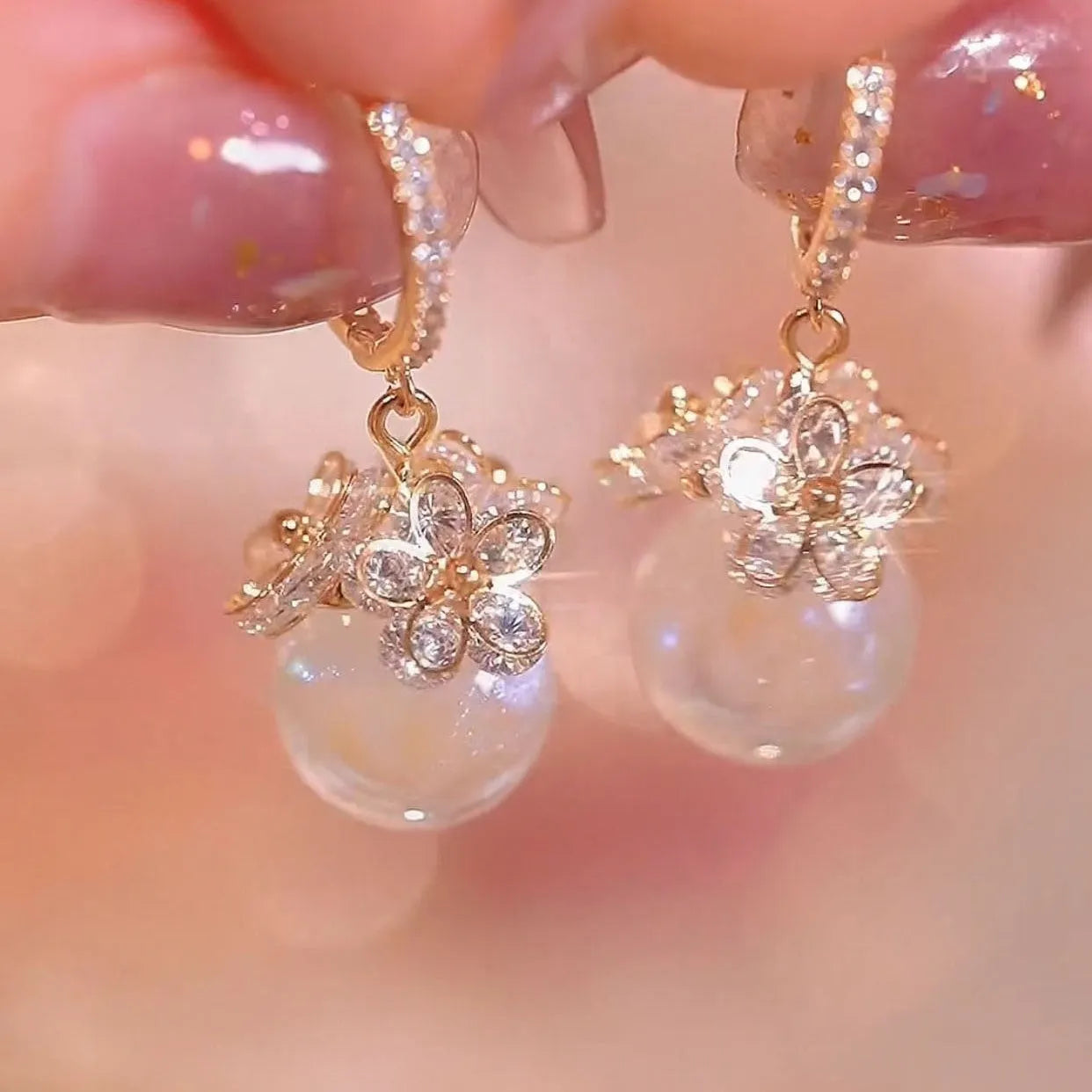 Women's copper geometric drop earrings with rose design and zircon accents in electroplated finish