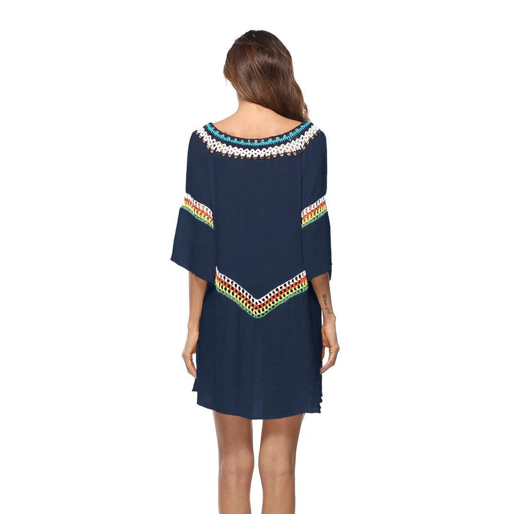 Crocheted white ethnic-style beach cover-up for women, shown as sun protection clothing.