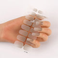 Sheet of 16 small solid colour nail art stickers with designs including cross, rose, tulip, and marble patterns.