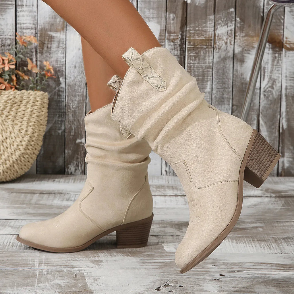 Women's suede mid-calf boots with a pointed toe and mid-height heel, shown in lotus root colour.