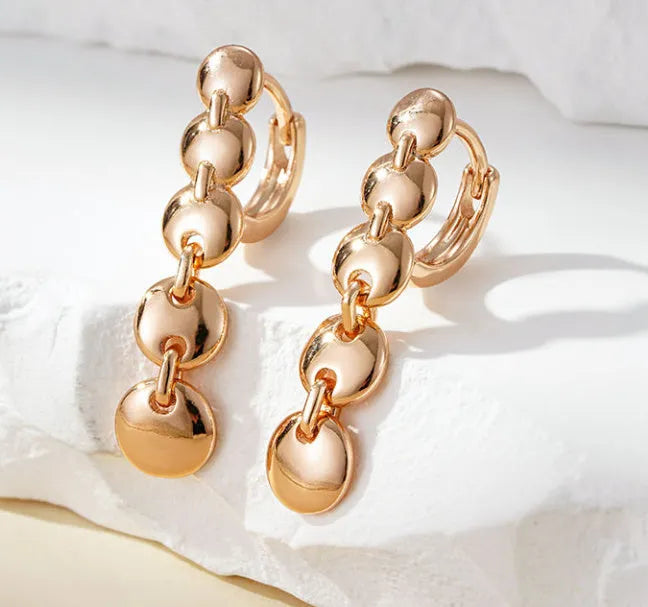 Retro long copper circle earrings with woven wirework and gold-coloured finish