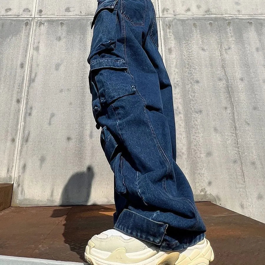 Dark blue distressed wide-leg jeans with a high waist and multiple pockets on a mannequin.