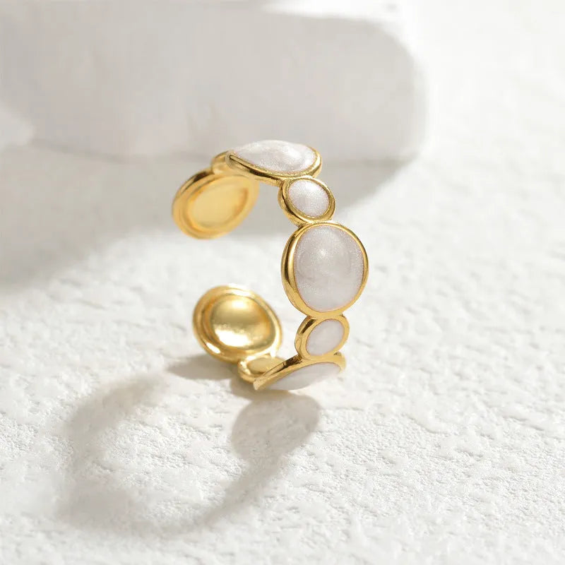 Geometric stainless steel ring with adjustable opening, electroplated metallic finish