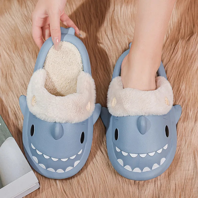 Winter shark button EVA house slippers in haze blue with sewing thread detail on indoor floor