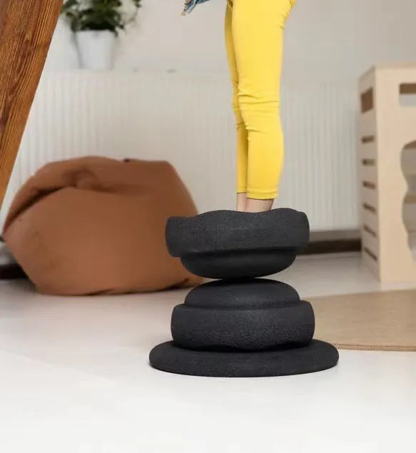 Plastic wood surf balance board for children, shown in mixed colour and black wood grain finishes.