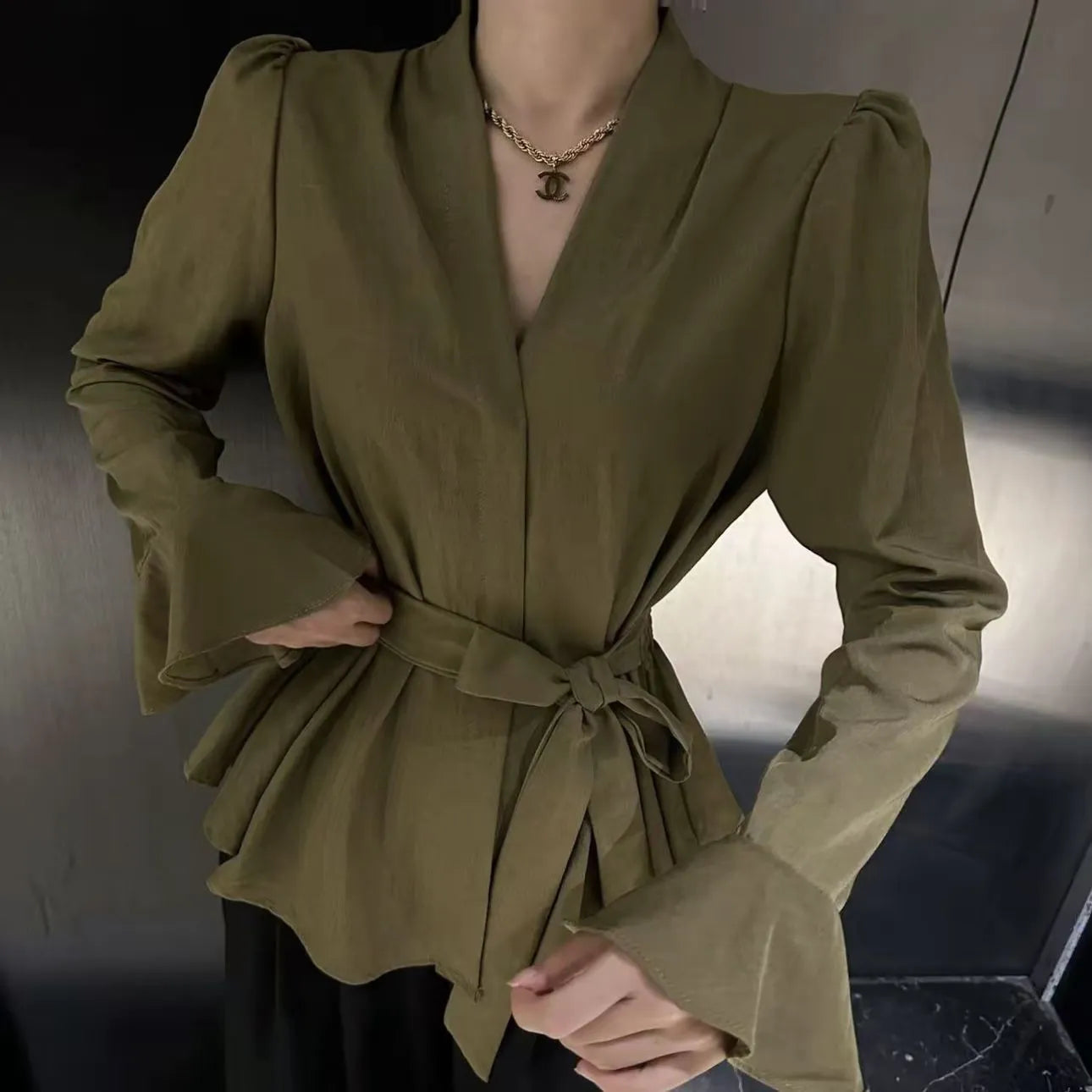 Women's French-style long sleeve shirt with irregular collar and bell sleeves in wine red.