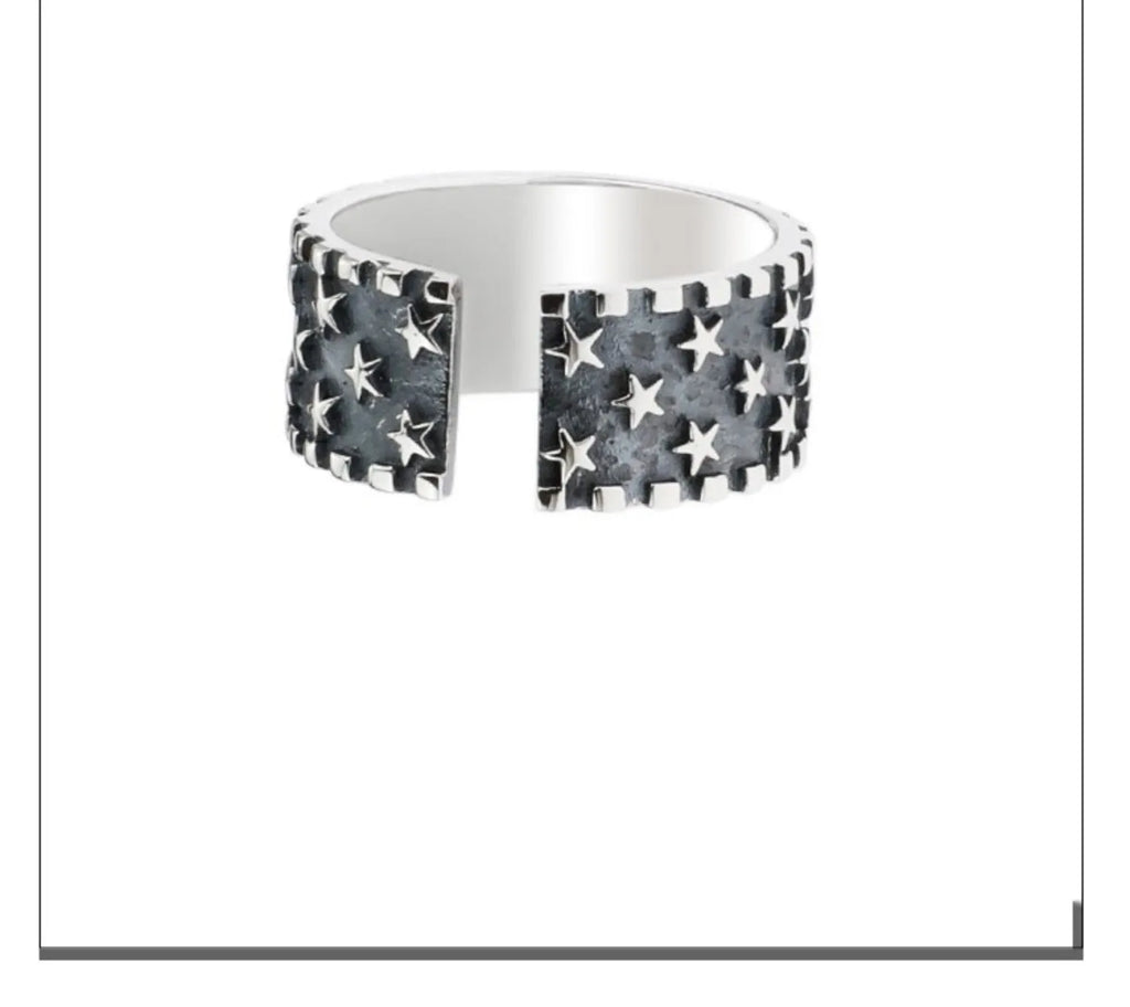 Adjustable silver ring with a multi-five pointed star geometric pattern on a solid 925 sterling silver band.