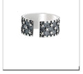 Adjustable silver ring with a multi-five pointed star geometric pattern on a solid 925 sterling silver band.