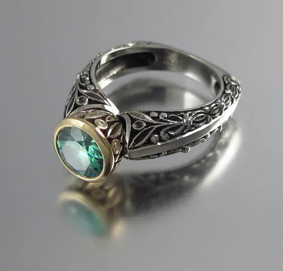 Flower-shaped gold-plated vintage gemstone ring with green silver colour separation design