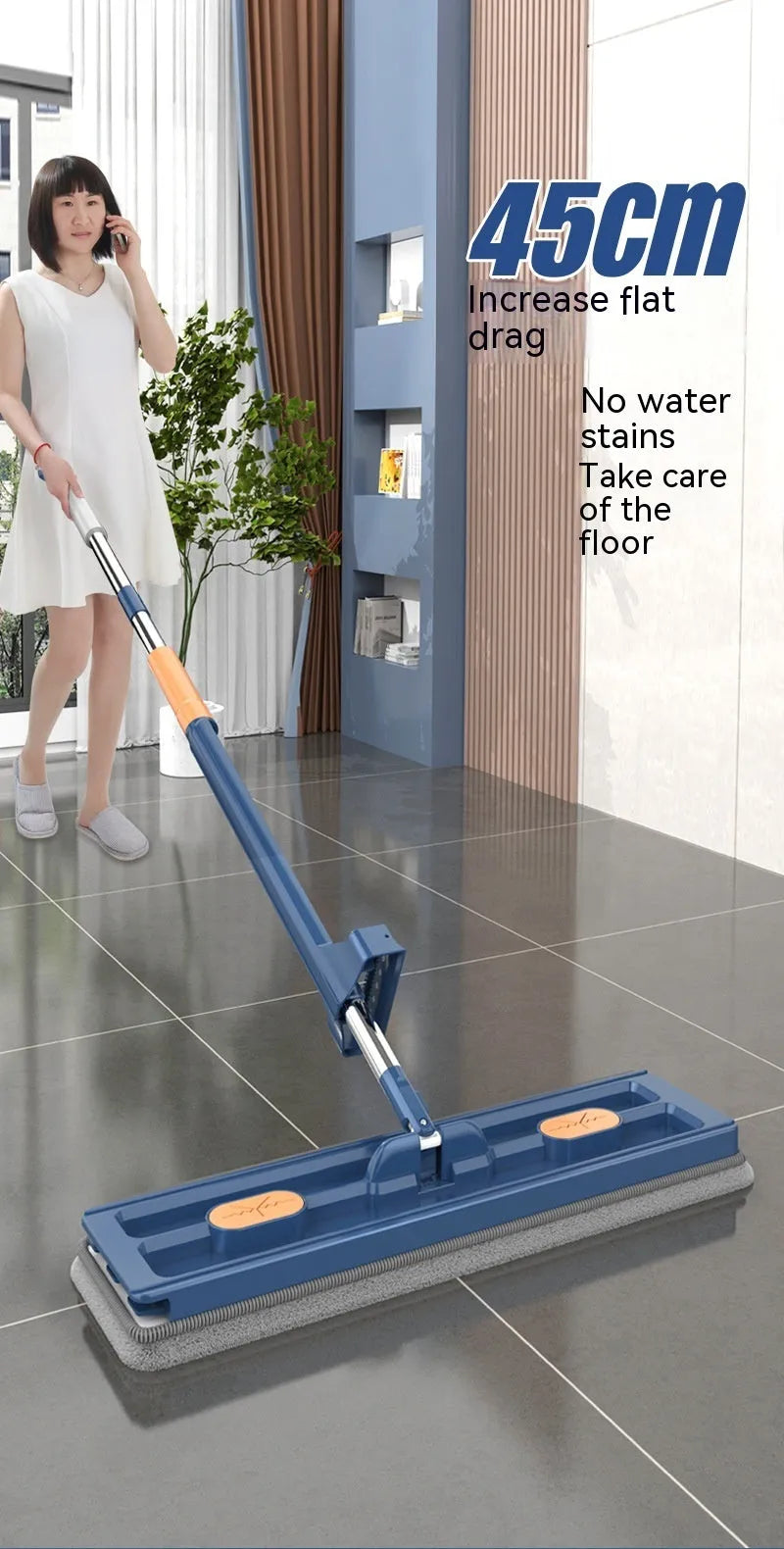 Large flat mop with stainless steel handle and blue cloth on hard floor