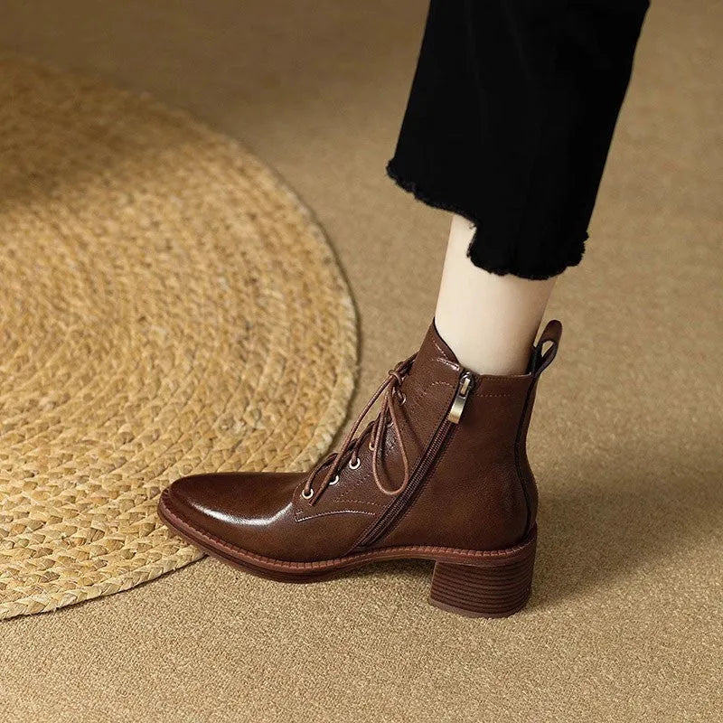 Women's black pointed-toe short tube boots with 5.5cm heel and velvet detailing on artificial PU upper