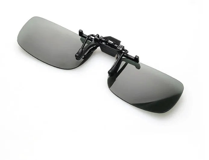 A clip-on sunglasses accessory with PC lenses shown in dark green, grey, and night vision tints, designed to fit over prescription glasses.