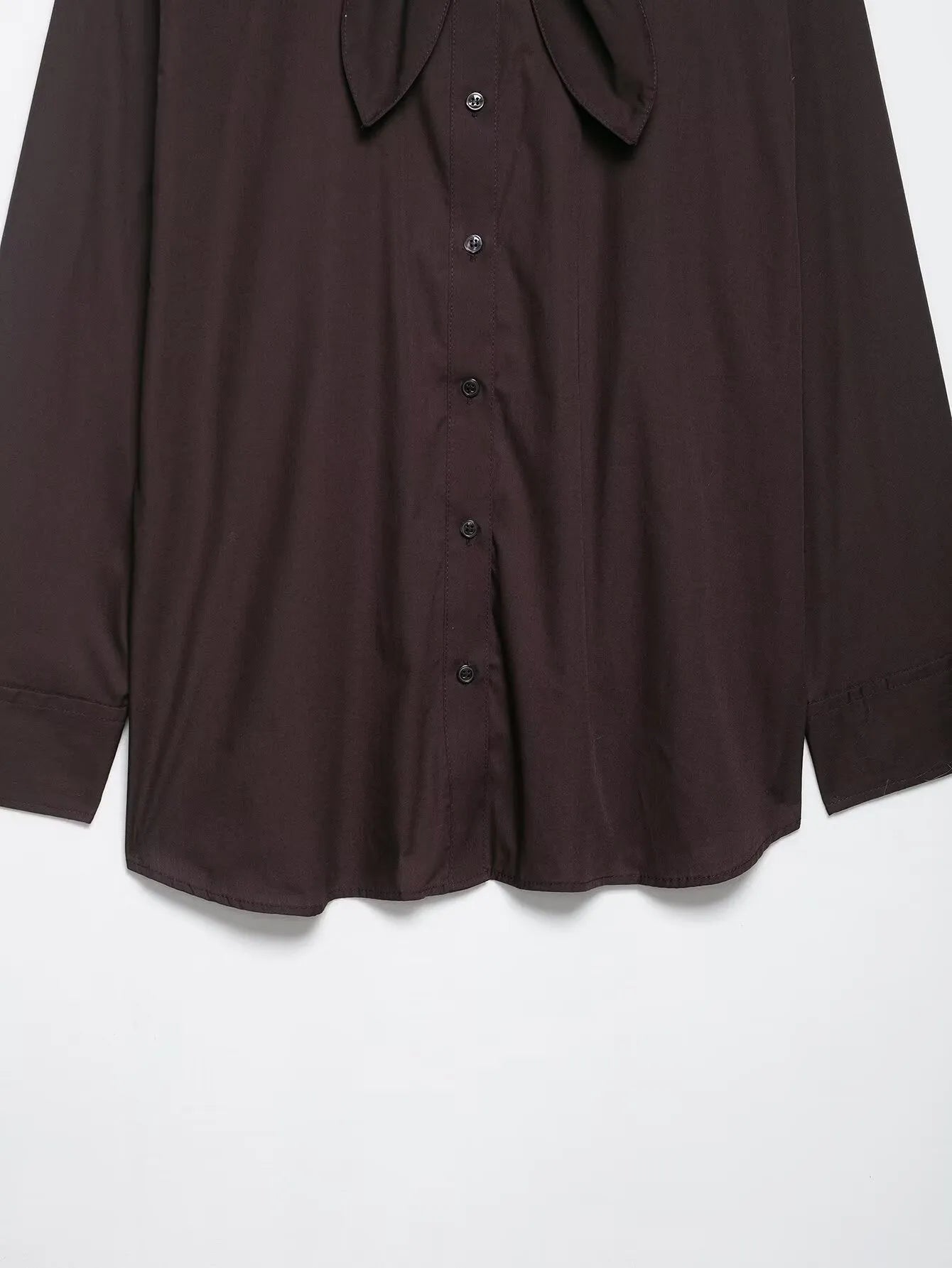 Brown women's poplin shirt with long sleeves, a bow tie, and a loose cardigan fit.