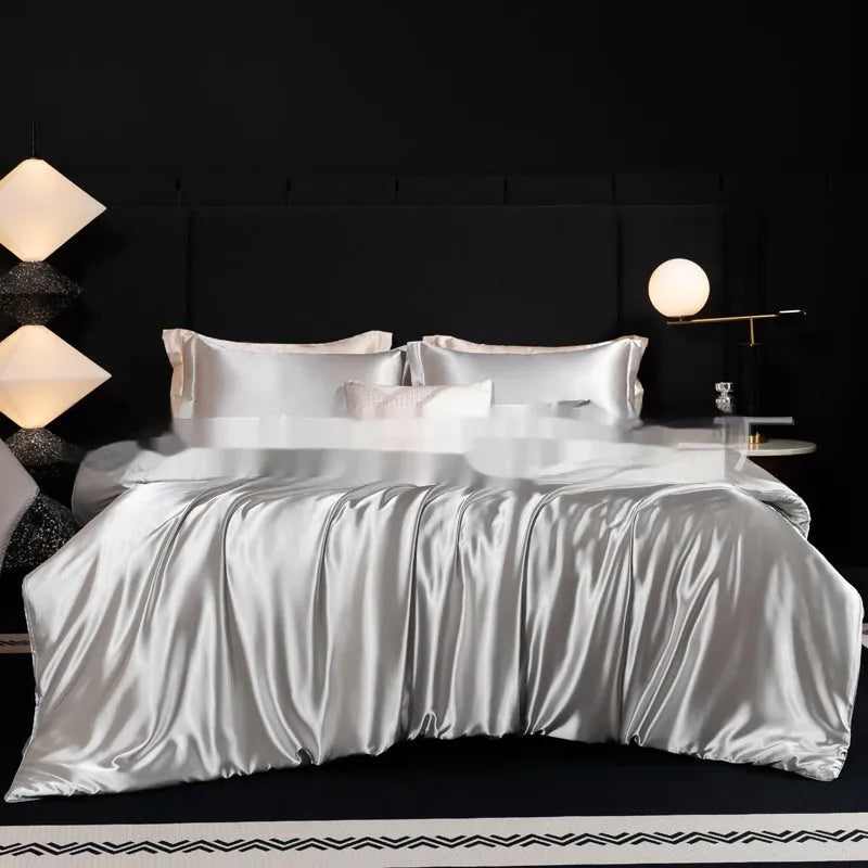 Silk bed sheet four-piece set in modern solid colours showing multiple size options for UK beds
