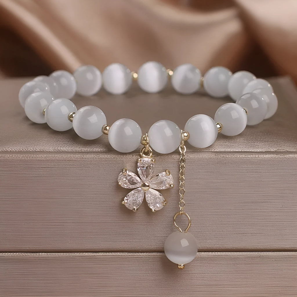 Women's white cat's eye crystal bracelet with flower tassel and morganite safety buckle pendant