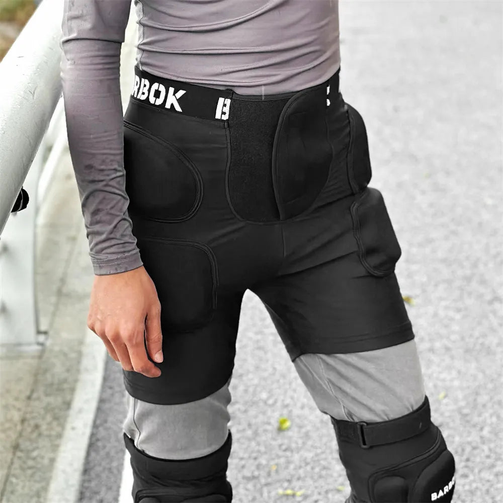 Black spandex hip protection pad pants with built-in grey NBR shock-absorbing pads for skating and skiing