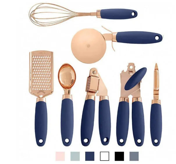 7-piece stainless steel kitchen tool set with copper plating peeler gadget in a cutlery rack on a countertop