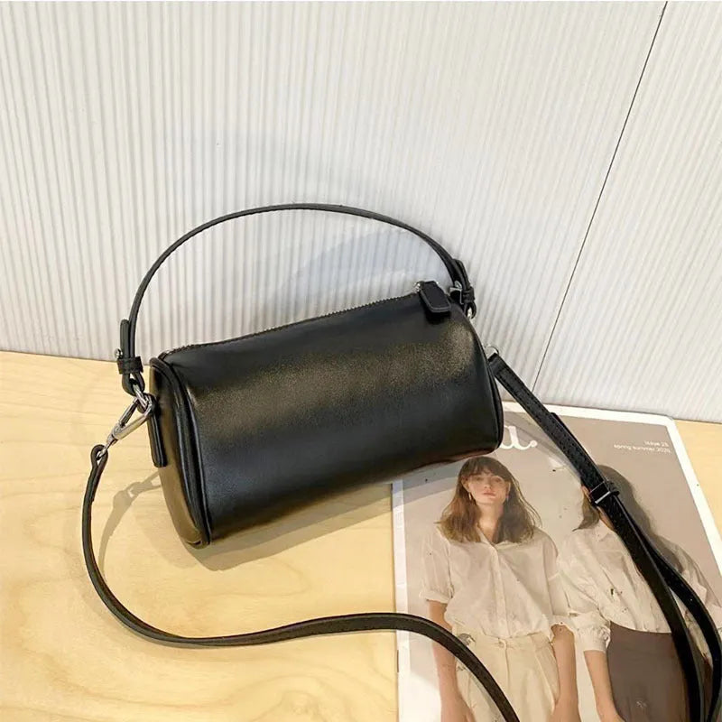 Genuine leather cylindrical crossbody phone bag in vegetable-tanned leather with single shoulder strap