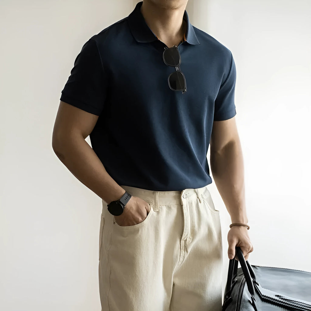 American-style short-sleeved polo shirt in a blue cotton-polyester blend on a hanger.