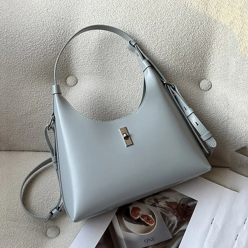 Genuine leather dumpling-shaped crossbody bag in apricot colour with shoulder strap