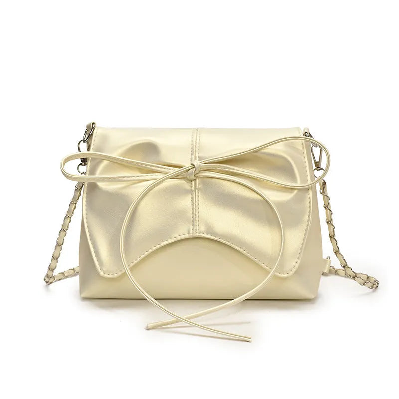 Women's black PU leather crossbody bag with a horizontal square shape and crossbody strap