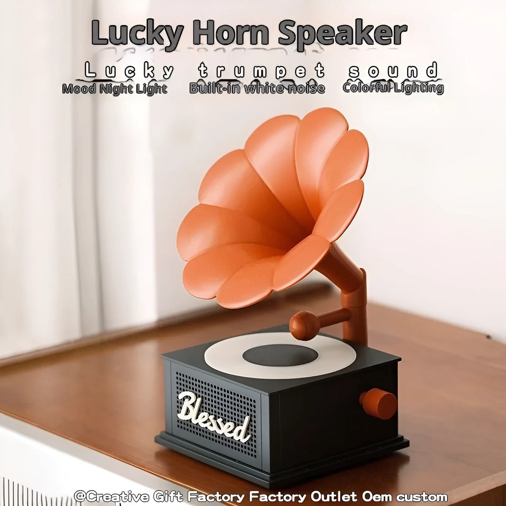 Retro white noise bluetooth speaker in black red, gray white, and lotus pink on a surface