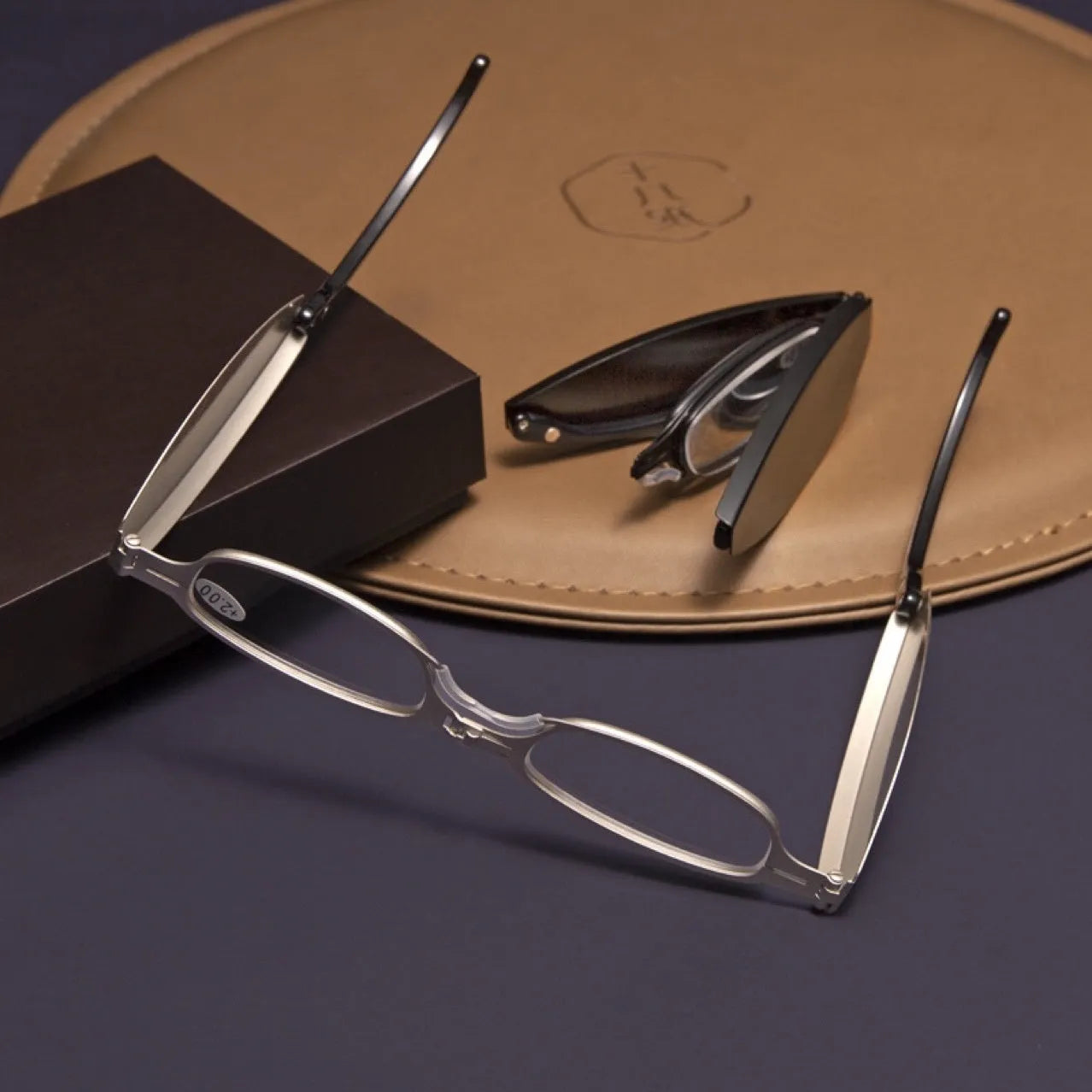 Black retro-style folding reading glasses for men, shown open and folded for pocket storage.
