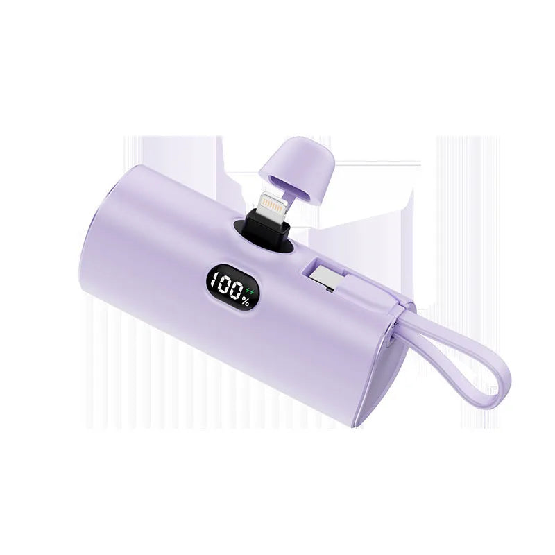Compact capsule-shaped power bank with digital display and wireless charging surface in multiple colour options