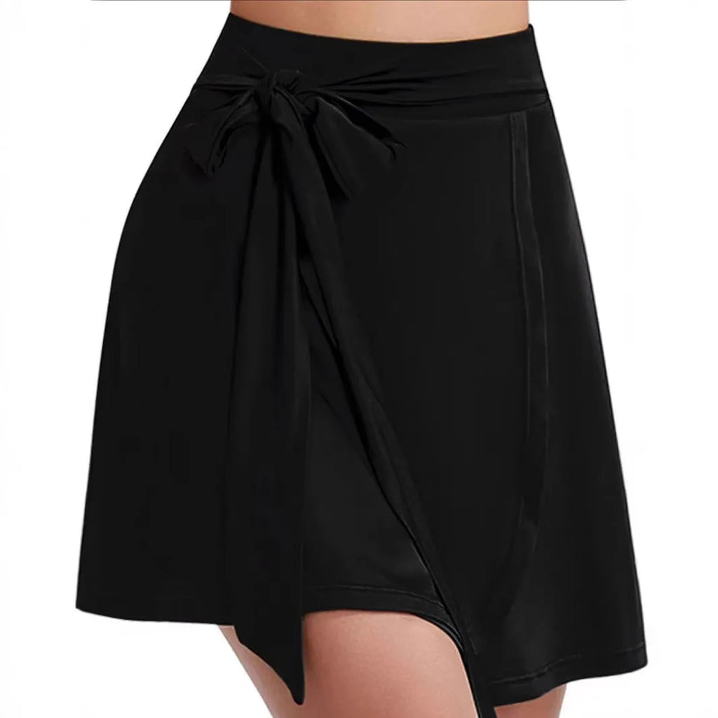 Black thigh-length sports skirt with built-in shorts, elastic high waist, and shoulder strap