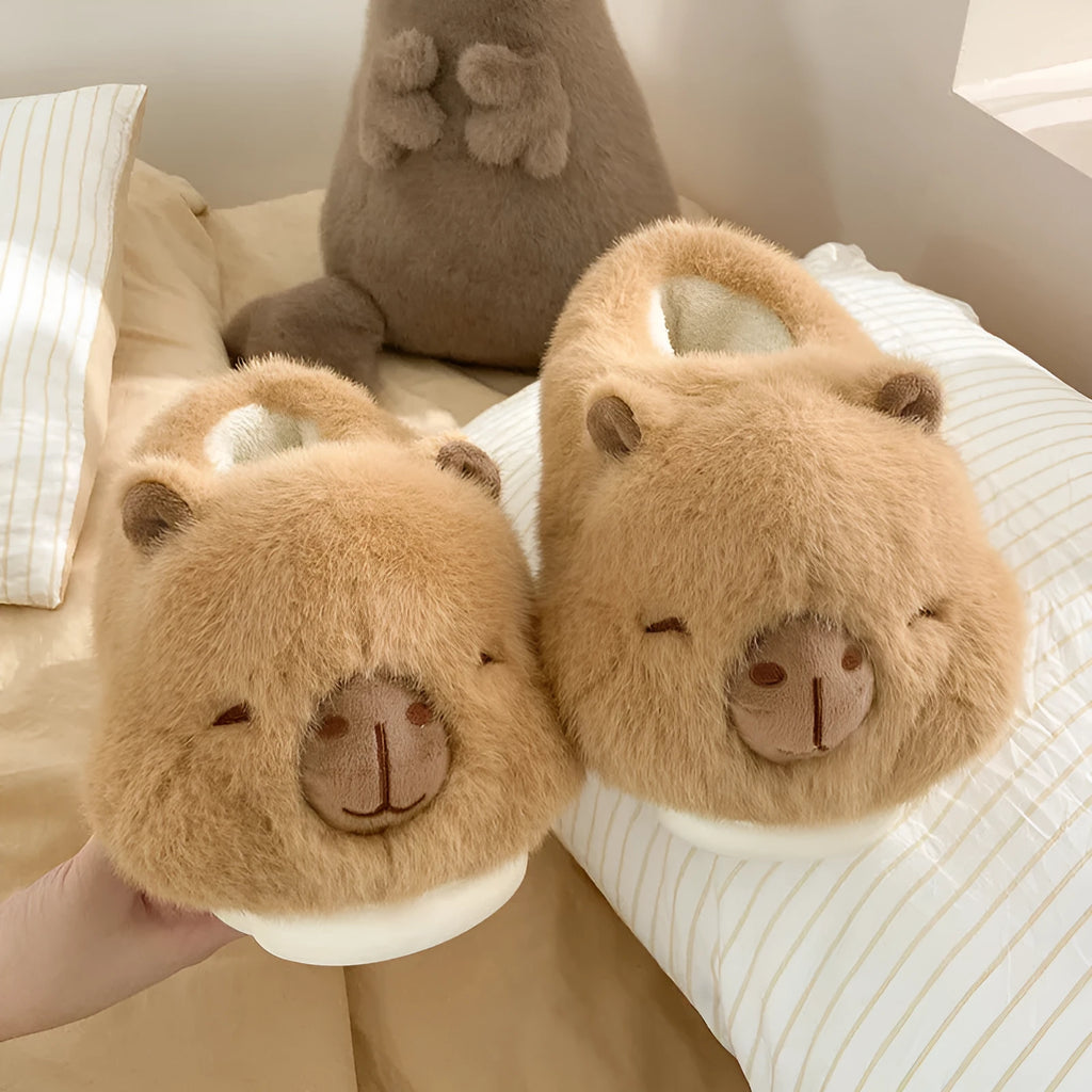 Light brown women's winter plush slippers with a cartoon pattern, round toe, and a pull-on oversleeve design.