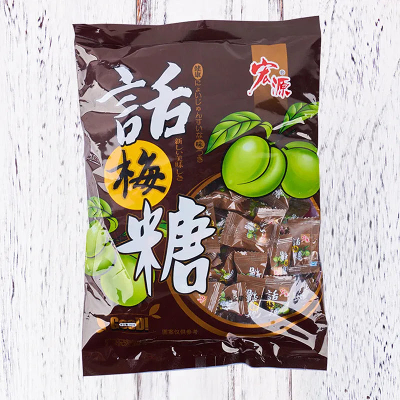 Bag containing three packets of hard candy: guava, plum sugar, and tangerine peel flavours.