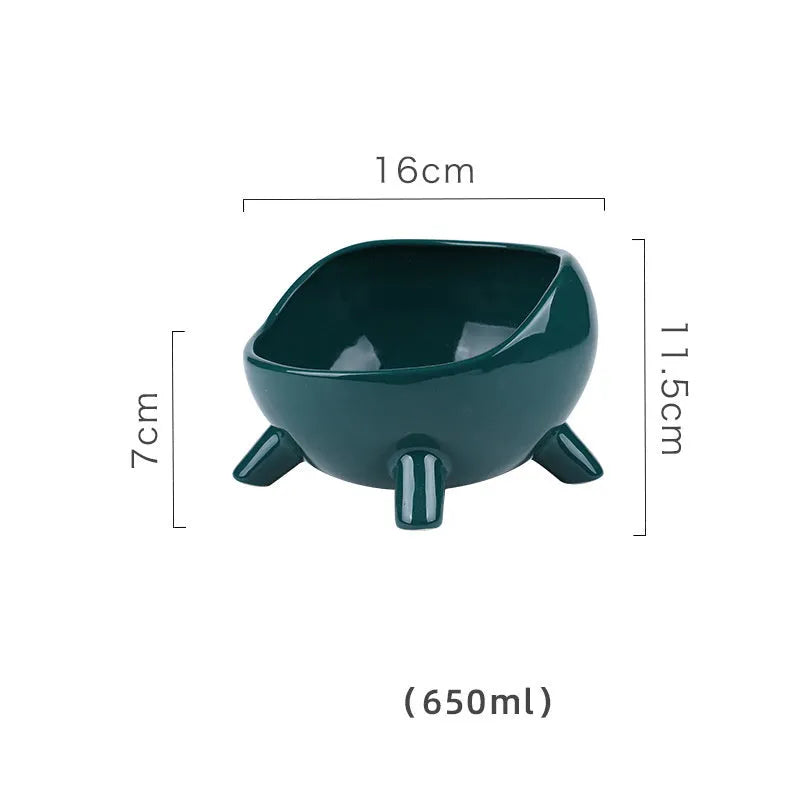 Green four-legged ceramic pet bowl for cats and small dogs on floor