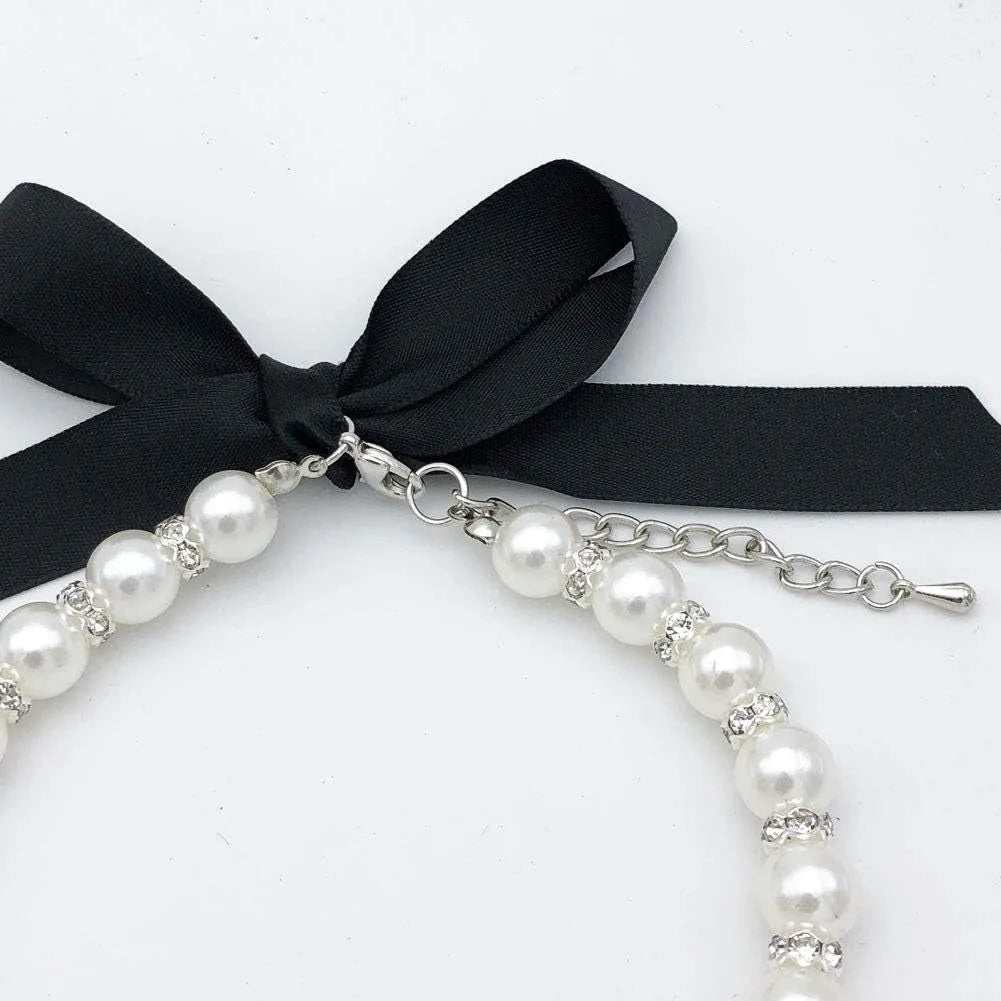 Adjustable pearl and rhinestone dog necklace on a soft ribbon in blue colour