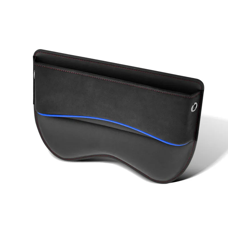 Black leather car seat storage box on a vehicle seat showing its rectangular shape and size.