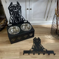 Personalised dog bowl holder with stainless steel basin and iron dog head base, showing custom name plate.