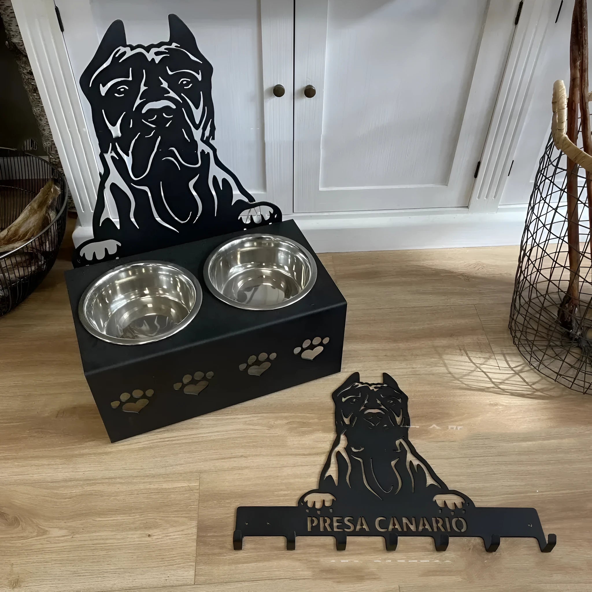 Personalised dog bowl holder with stainless steel basin and iron dog head base, showing custom name plate.