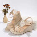 Women's beige wedge sandals with fabric uppers and fish-mouth toe design