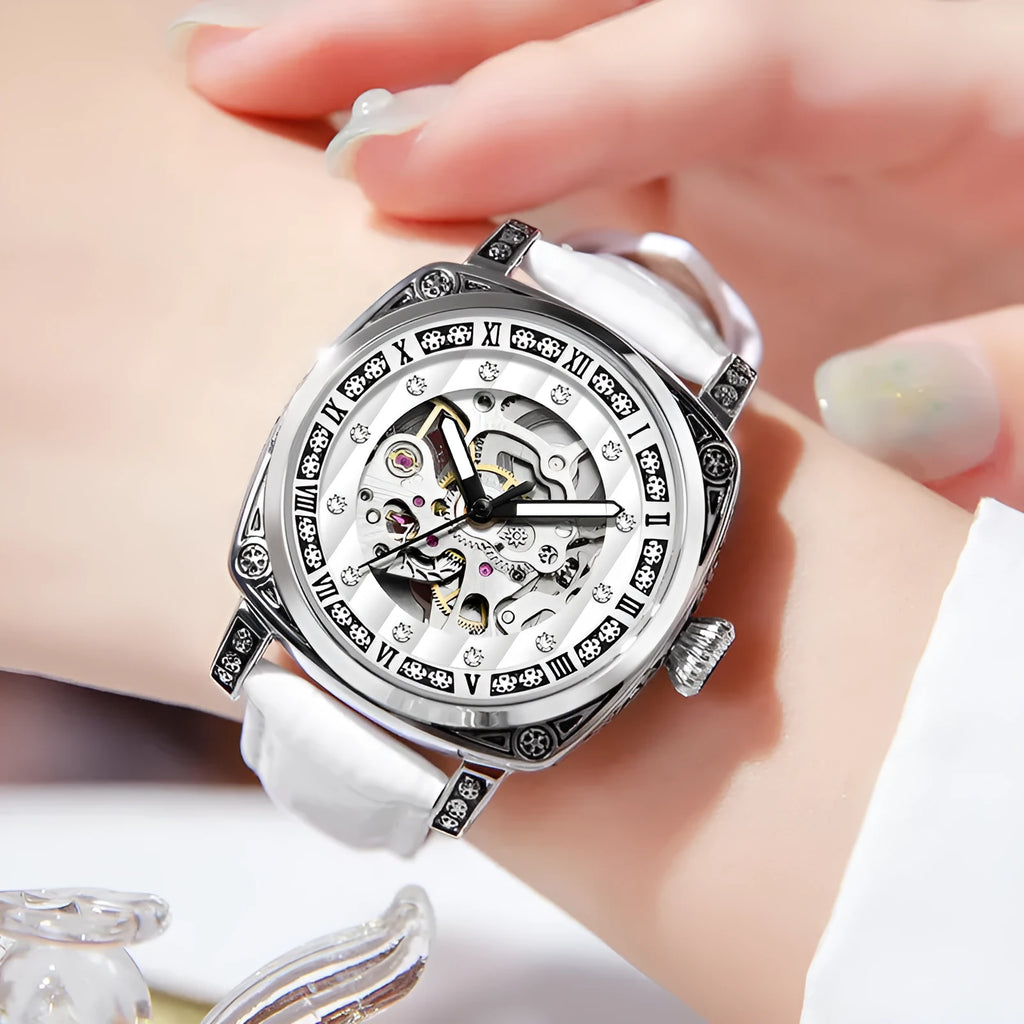 Mechanical watch with luminous numerals on a leather strap, shown in multiple colour options.