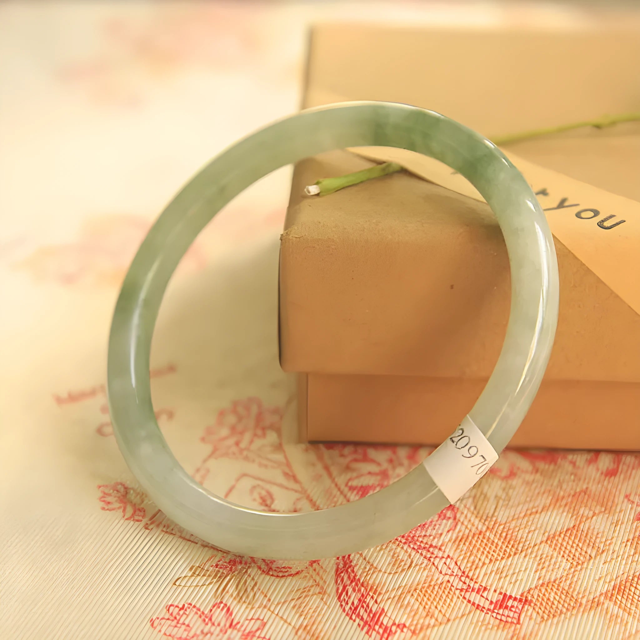 Green handmade jade waxy student bracelet with geometric beads in Chinese style, showing adjustable sizing options