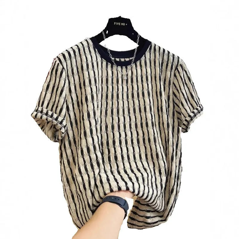 Black and white striped men's short sleeve loose fit pullover shirt on a hanger.