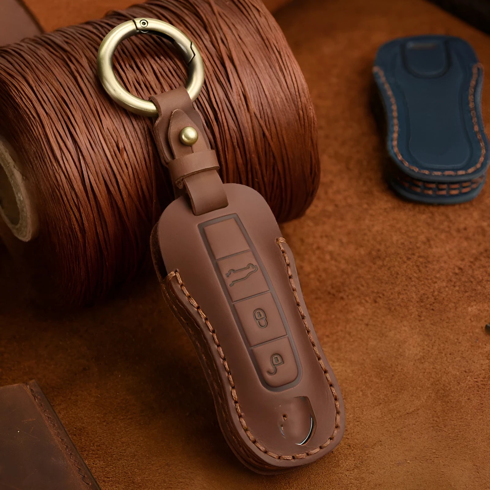 Genuine cowhide leather Porsche key cover with retro bag buckle in blue or brown.