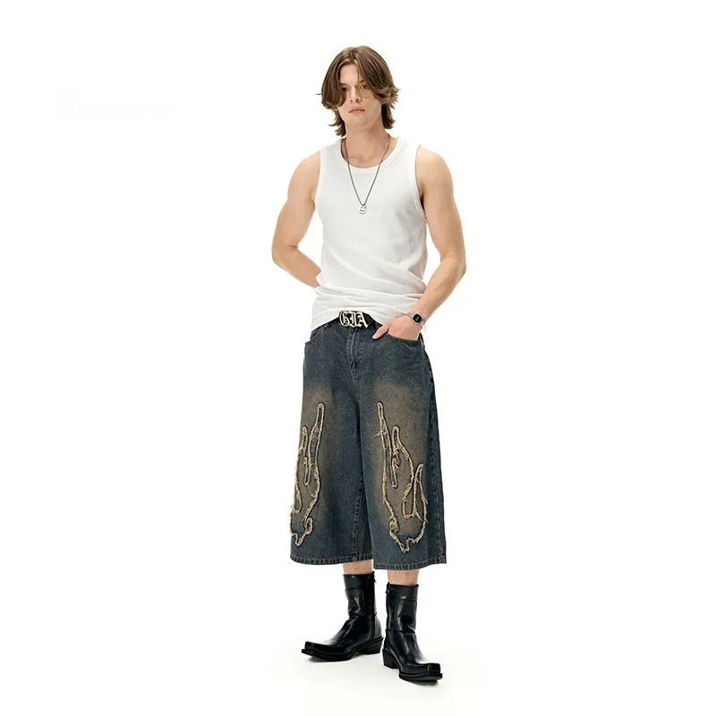 Men's black denim shorts with flame embroidery patches on leg, straight cut streetwear style