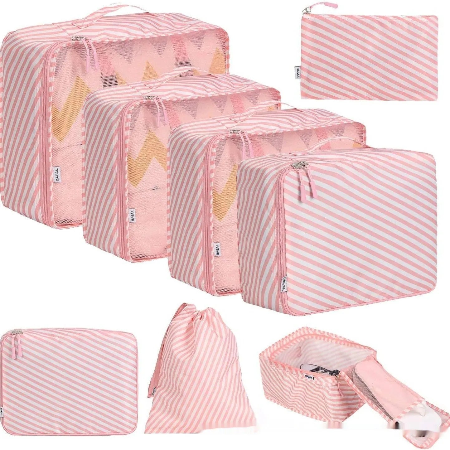 Set of eight cubic-shaped travel packing bags in assorted colours including beige, black, pink, and leopard print patterns.
