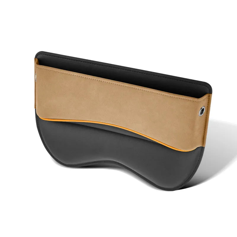 Black leather car seat storage box on a vehicle seat showing its rectangular shape and size.