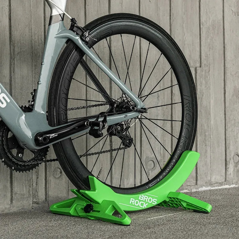 Black and green ABS plastic bicycle parking rack holder for road and mountain bike storage