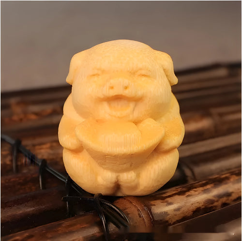 Solid bamboo carving ornament showing ingot pig design with 4cm height