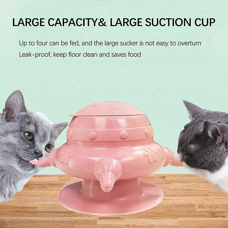 Pink silicone pet nursing milk feeder bowl with four pacifiers on a flat base.